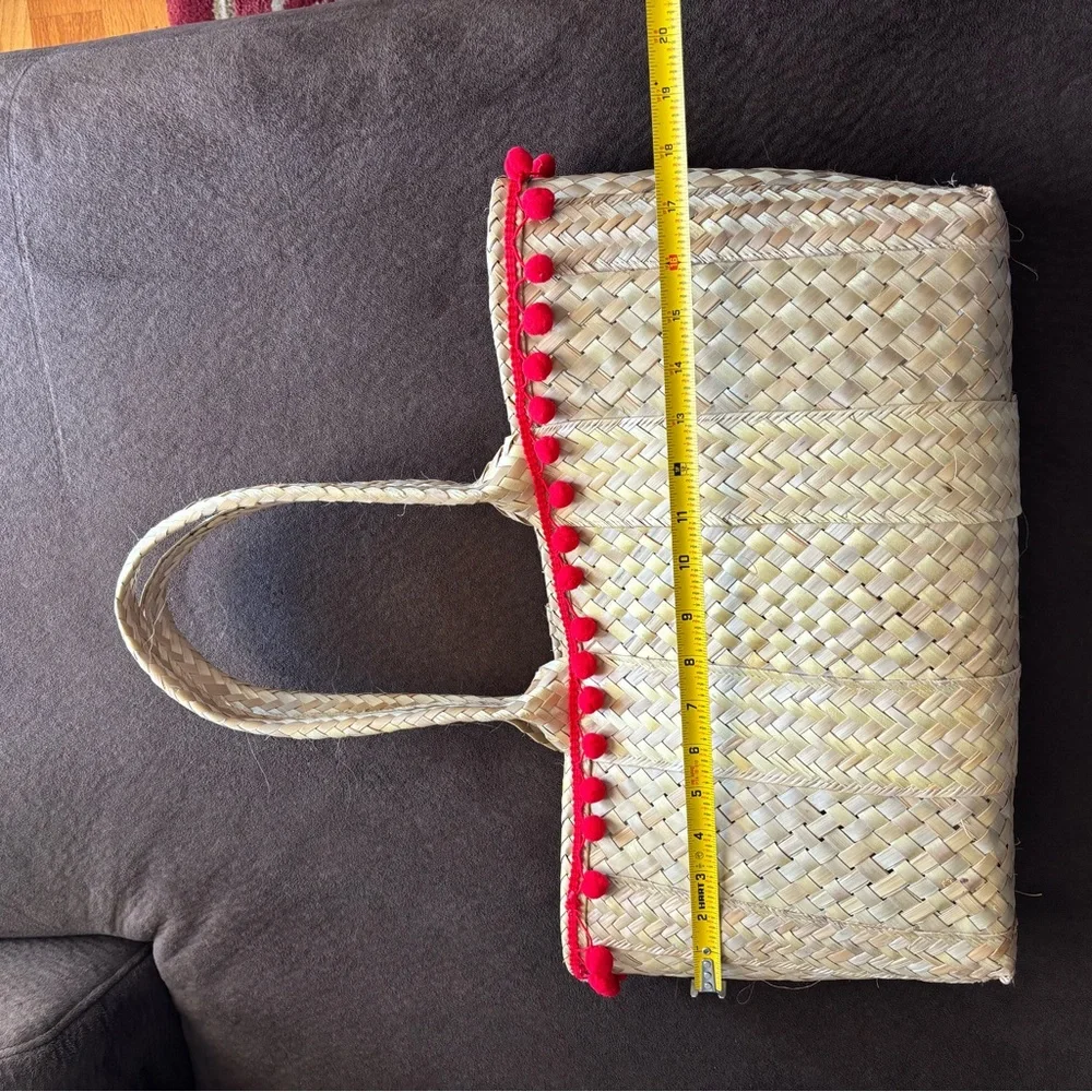 Handwoven Natural Straw Tote with Red Pom-Pom Trim - Picture 3 of 6